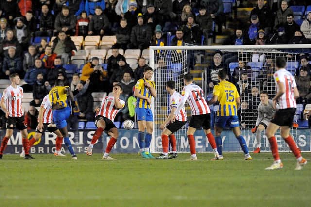 Dan Udoh scores the equaliser for Shrewsbury