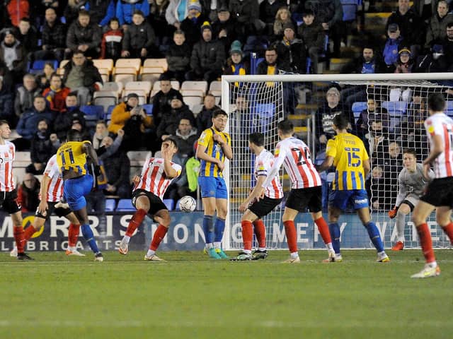 Dan Udoh scores the equaliser for Shrewsbury