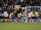 Dan Udoh scores the equaliser for Shrewsbury