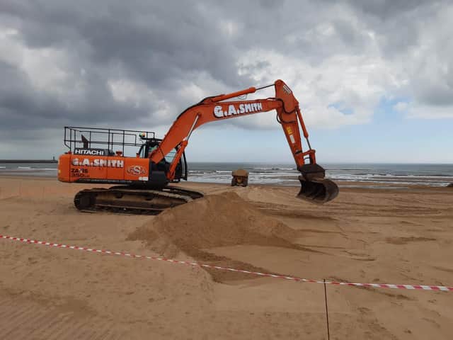Teams out cleaning the beach
