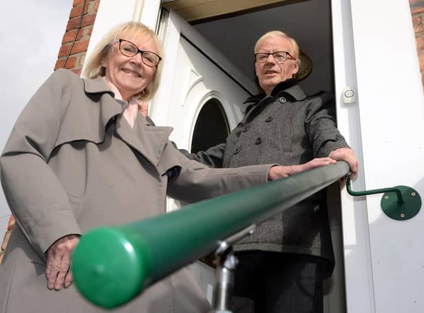 South Tyneside Council Cllr Anne Hetherington with resident Kenneth Stephenson, and the grab rail fitted to the outside of his home.