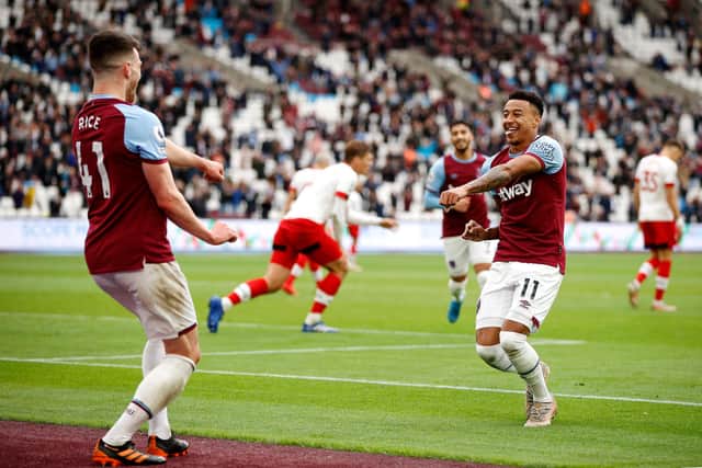 LONDON, ENGLAND - MAY 23: Declan Rice of West Ham United celebrates with team mate Jesse Lingard after scoring his team's third goal during the Premier League match between West Ham United and Southampton at London Stadium on May 23, 2021 in London, England. (Photo by John Sibley - Pool/Getty Images)