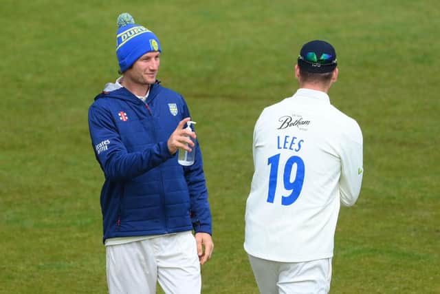 Durham 12th man Cameron Bancroft offers Alex Lees hand sanitizer during Day four of the LV= Insurance County Championship match between Durham and Worcestershire.