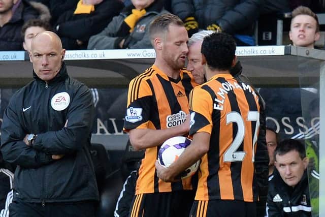 David Meyler of Hull City clashes with Alan Pardew, Manager of Newcastle United during the Barclays Premier League match between Hull City and Newcastle United at KC Stadium on March 1, 2014 in Hull, England.  (Photo by Tony Marshall/Getty Images)