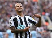 Newcastle player Bruno Guimaraes celebrates his second goal by pointing to the club badge during the Premier League match between Newcastle United and Brentford FC at St. James Park on October 08, 2022 in Newcastle upon Tyne, England. (Photo by Stu Forster/Getty Images)