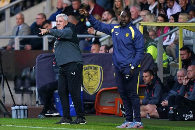 Newcastle United manager Steve Bruce and Burton Albion manager Jimmy Floyd Hasselbaink.
