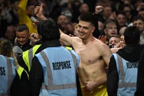 Newcastle United goalkeeper Nick Pope celebrates with fans at the City Ground.