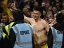 Newcastle United goalkeeper Nick Pope celebrates with fans at the City Ground.