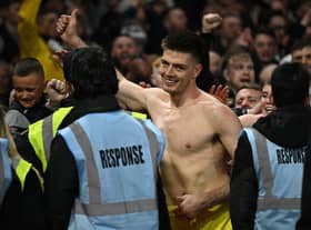 Newcastle United goalkeeper Nick Pope celebrates with fans at the City Ground.
