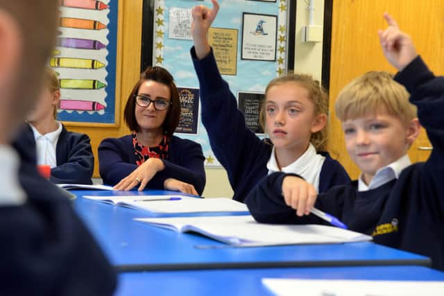 Pupils are keen to ask questions at the recently reopened academy.