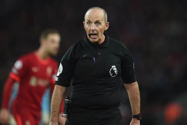 Mike Dean reacts during the English Premier League football match between Liverpool and Newcastle United at Anfield in Liverpool(Photo by OLI SCARFF/AFP via Getty Images)