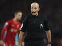 Mike Dean reacts during the English Premier League football match between Liverpool and Newcastle United at Anfield in Liverpool(Photo by OLI SCARFF/AFP via Getty Images)