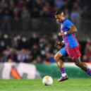 Memphis Depay of Barcelona dribbles with the ball during the LaLiga Santander match between FC Barcelona and Cadiz CF at Camp Nou on April 18, 2022 in Barcelona, Spain. (Photo by David Ramos/Getty Images)