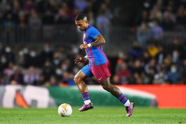 Memphis Depay of Barcelona dribbles with the ball during the LaLiga Santander match between FC Barcelona and Cadiz CF at Camp Nou on April 18, 2022 in Barcelona, Spain. (Photo by David Ramos/Getty Images)