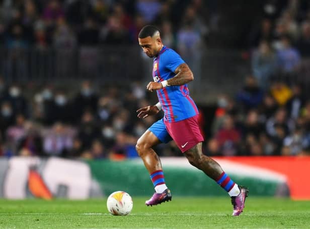 Memphis Depay of Barcelona dribbles with the ball during the LaLiga Santander match between FC Barcelona and Cadiz CF at Camp Nou on April 18, 2022 in Barcelona, Spain. (Photo by David Ramos/Getty Images)