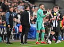Newcastle United goalkeeper Martin Dubravka replaces midfielder Elliot Anderson on Saturday as head coach Eddie Howe looks on.