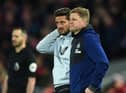 Newcastle United's head coach Eddie Howe (R) and his assistant Jason Tindall (L) looks on during the English Premier League football match between Liverpool and Newcastle United at Anfield in Liverpool (Photo by OLI SCARFF/AFP via Getty Images)