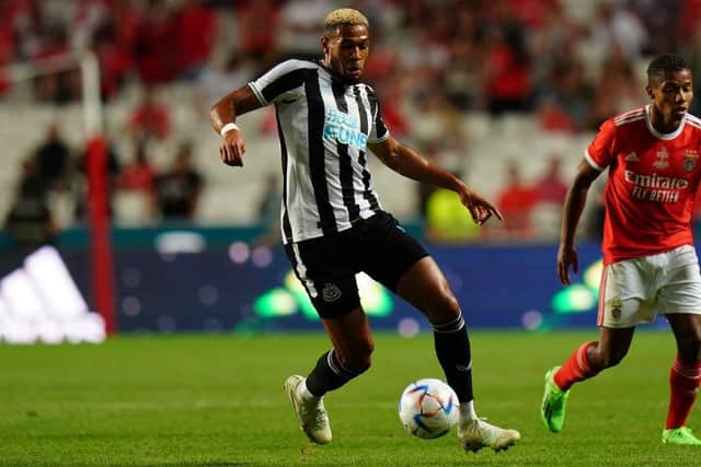 Joelinton of Newcastle United FC with David Neres of SL Benfica in action during the Eusebio Cup match between SL Benfica and Newcastle United at Estadio da Luz on July 26, 2022 in Lisbon, Portugal.  (Photo by Gualter Fatia/Getty Images)