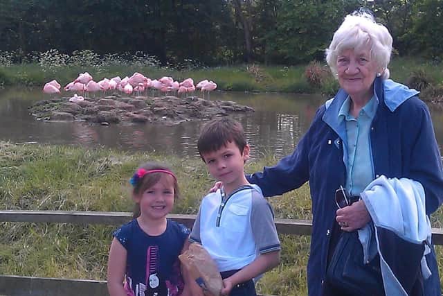 Elizabeth, pictured with two of her great-grandchildren, was 'devoted' to her family.