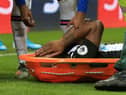 Newcastle United's Dutch defender Jetro Willems reacts as he is stretchered off injured during the English Premier League football match between Newcastle United and Chelsea at St James' Park in Newcastle-upon-Tyne, north east England on January 18, 2020.