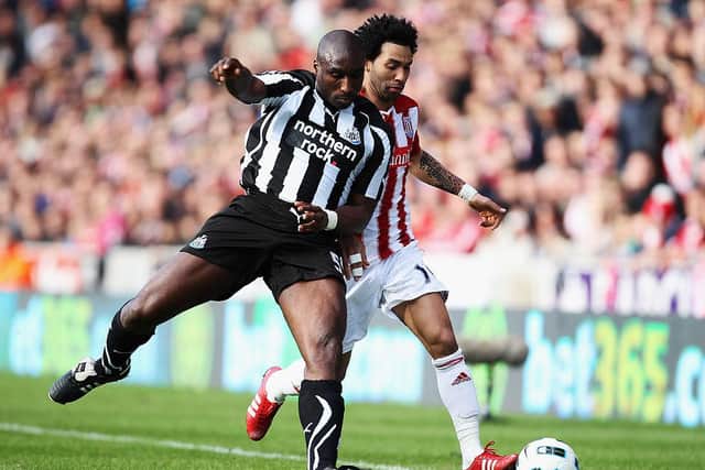 Jermaine Pennant of Stoke City battles with Sol Campbell of Newcastle United during the Barclays Premier League match between Stoke City and Newcastle United at Britannia Stadium on March 19, 2011 in Stoke on Trent, England.  (Photo by Bryn Lennon/Getty Images)