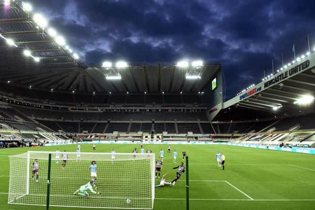 Newcastle player Joe Willock scores the third Newcastle goal after having his penalty saved by Scott Carson during the Premier League match between Newcastle United and Manchester City at St. James Park on May 14, 2021 in Newcastle upon Tyne, England.