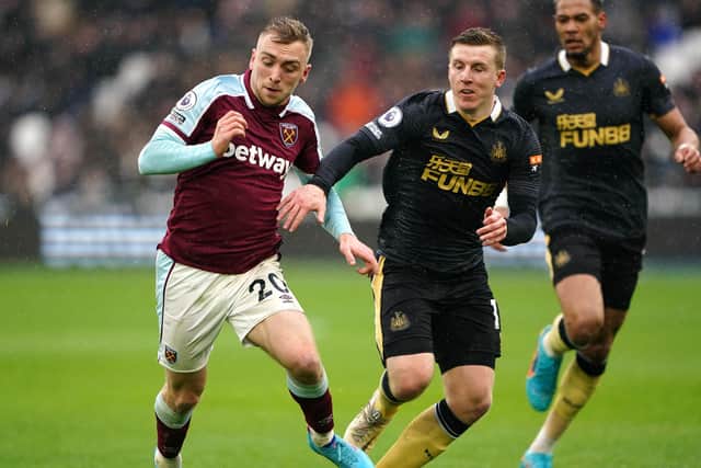 West Ham United's Jarrod Bowen and Newcastle United's Matt Targett battle for the ball.