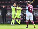 Allan Saint-Maximin of Newcastle United celebrates with Jonjo Shelvey after scoring their side's second goal during the Premier League match between Burnley and Newcastle United at Turf Moor on April 11, 2021 in Burnley, England.