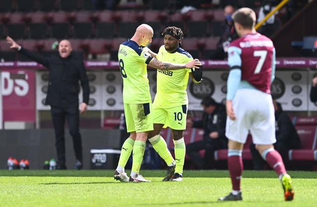 Allan Saint-Maximin of Newcastle United celebrates with Jonjo Shelvey after scoring their side's second goal during the Premier League match between Burnley and Newcastle United at Turf Moor on April 11, 2021 in Burnley, England.