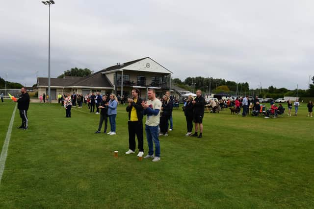 A minutes applause was held before kick off.