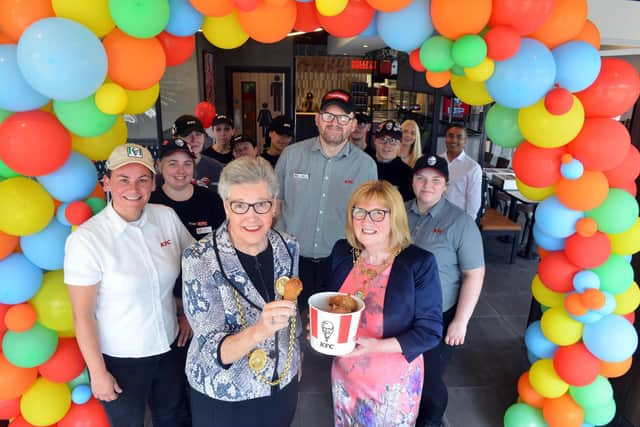 KFC South Shields opens its doors for customers following a refurbishment. Mayor Pat Hay and mayoress Jean Copp with the team.