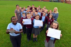 St Bede's Primary School children have sent personal letters to England player Marcus Rashford, Bukayo Saka and Jadon Sancho following racist abuse after the Euro 2020 final defeat. From left Ivan Murwisi, nine, Joshua Rixom, nine, Jessica Roberts, nine and Lainey Bradley, nine with teacher Jessica Romano and teaching assistant Sharon Hunt.