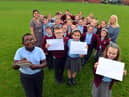 St Bede's Primary School children have sent personal letters to England player Marcus Rashford, Bukayo Saka and Jadon Sancho following racist abuse after the Euro 2020 final defeat. From left Ivan Murwisi, nine, Joshua Rixom, nine, Jessica Roberts, nine and Lainey Bradley, nine with teacher Jessica Romano and teaching assistant Sharon Hunt.