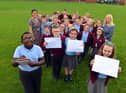 St Bede's Primary School children have sent personal letters to England player Marcus Rashford, Bukayo Saka and Jadon Sancho following racist abuse after the Euro 2020 final defeat. From left Ivan Murwisi, nine, Joshua Rixom, nine, Jessica Roberts, nine and Lainey Bradley, nine with teacher Jessica Romano and teaching assistant Sharon Hunt.