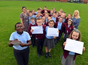 St Bede's Primary School children have sent personal letters to England player Marcus Rashford, Bukayo Saka and Jadon Sancho following racist abuse after the Euro 2020 final defeat. From left Ivan Murwisi, nine, Joshua Rixom, nine, Jessica Roberts, nine and Lainey Bradley, nine with teacher Jessica Romano and teaching assistant Sharon Hunt.