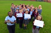 St Bede's Primary School children have sent personal letters to England player Marcus Rashford, Bukayo Saka and Jadon Sancho following racist abuse after the Euro 2020 final defeat. From left Ivan Murwisi, nine, Joshua Rixom, nine, Jessica Roberts, nine and Lainey Bradley, nine with teacher Jessica Romano and teaching assistant Sharon Hunt.