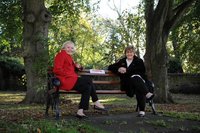 South Tyneside Council Lead Member Independence and Well-being Cllr Anne Hetherington and Cllr Tracey Dixon with one of the new Happy to Chat benches, in Whitburn Village.