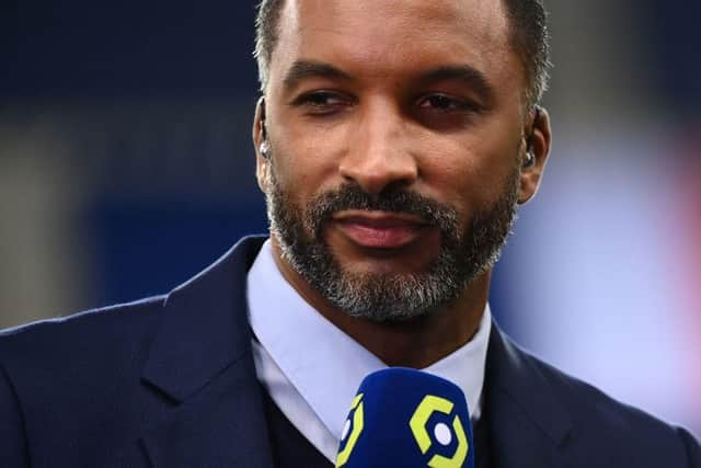 French former football player and Canal Plus TV host Habib Beye speaks prior to the French L1 football match between Paris-Saint Germain (PSG) and AS Monaco FC at The Parc des Princes Stadium in Paris on February 21, 2021. (Photo by FRANCK FIFE / AFP) (Photo by FRANCK FIFE/AFP via Getty Images)