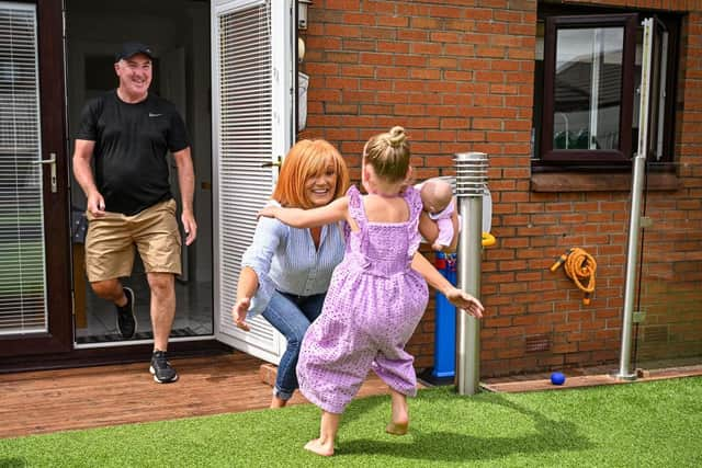 Raymond and Shirley Walsh meet with their grandchildren Penelope 5 and Valentina 3 following a relaxing of lockdown rules. The changes allow families to meet people from two different households outside but still in groups of no more than eight people.  (Photo by Jeff J Mitchell/Getty Images)