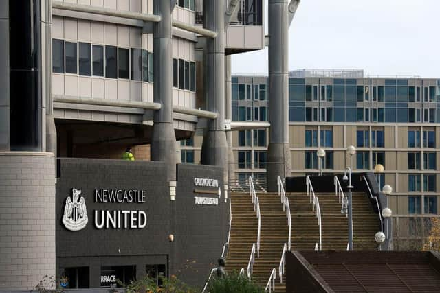 A lone security guard stands on duty outside the empty stadium ahead of the English Premier League football match between Newcastle United and Chelsea at St James' Park in Newcastle-upon-Tyne, north east England on November 21, 2020.