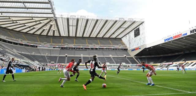 Newcastle United's French midfielder Allan Saint-Maximin (C) runs with the ball during the English Premier League football match between Newcastle United and Sheffield United at St James' Park in Newcastle-upon-Tyne, north east England on June 21, 2020.