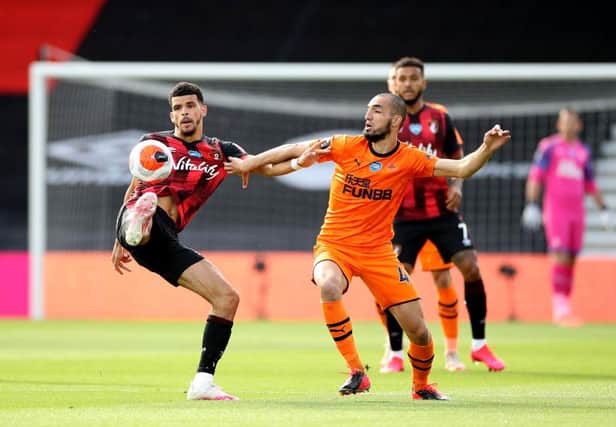Nabil Bentaleb of Newcastle United and Philip Billing of Bournemouth battle for possession during the Premier League match between AFC Bournemouth and Newcastle United at Vitality Stadium on July 01, 2020 in Bournemouth, England.