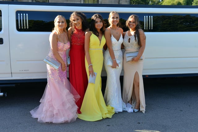 Year 11 girls alongside the white limousine they arrived in.