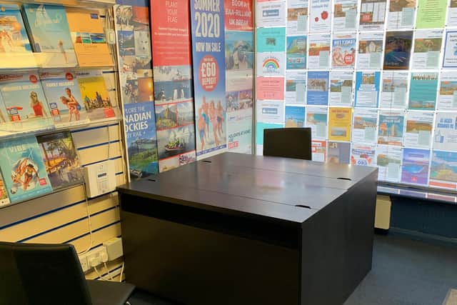Desks have been pushed together to ensure two-metres between staff and customers.