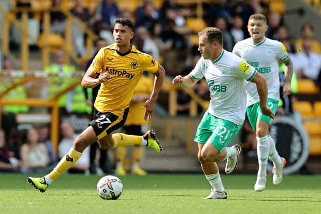 Matheus Luiz Nunes of Wolverhampton Wanderers gets away from Ryan Fraser during the Premier League match between Wolverhampton Wanderers and Newcastle United at Molineux on August 28, 2022 in Wolverhampton, England. (Photo by David Rogers/Getty Images)