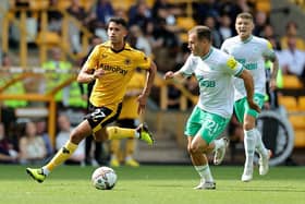 Matheus Luiz Nunes of Wolverhampton Wanderers gets away from Ryan Fraser during the Premier League match between Wolverhampton Wanderers and Newcastle United at Molineux on August 28, 2022 in Wolverhampton, England. (Photo by David Rogers/Getty Images)