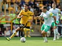 Matheus Luiz Nunes of Wolverhampton Wanderers gets away from Ryan Fraser during the Premier League match between Wolverhampton Wanderers and Newcastle United at Molineux on August 28, 2022 in Wolverhampton, England. (Photo by David Rogers/Getty Images)