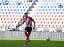 Charlie Wyke scores against Wigan earlier this year