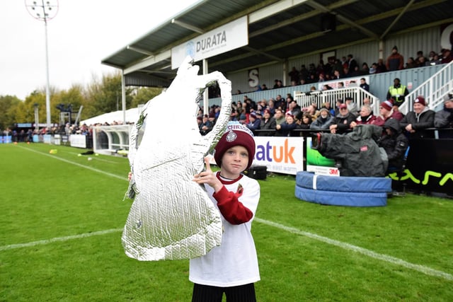 A young fan has the team covered with his own FA Cup, just in case. Picture: Kev Wilson.