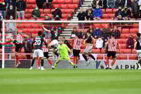Tom Hopper scores the crucial goal for Lincoln City